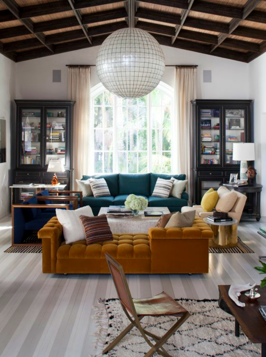 A few tips on how to style the space above your living room sofa.